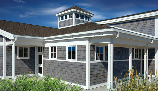 Nature center building with western red cedar shingle siding prefinished in semi-transparent Driftwood Gray