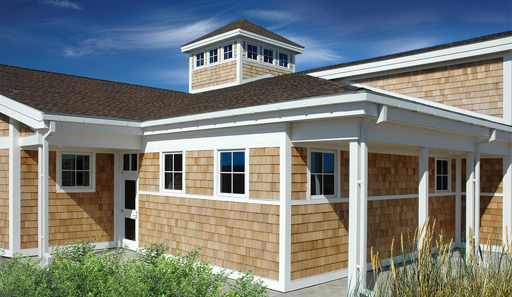Nature center building with unfinished western red cedar shingle siding.