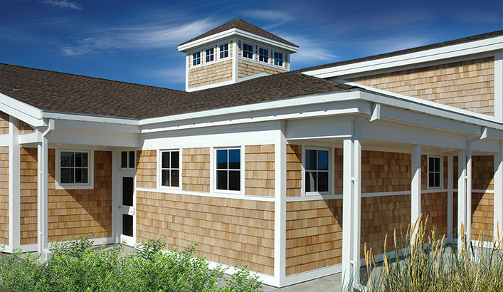 Nature center building with unfinished western red cedar shingle siding.